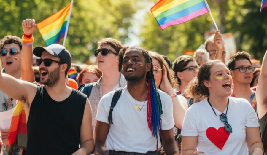 A vibrant scene of a Pride parade, featuring a diverse crowd