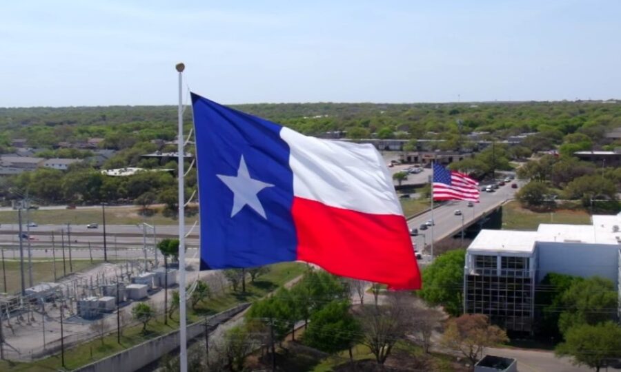 Flags of Texas and USA on poles