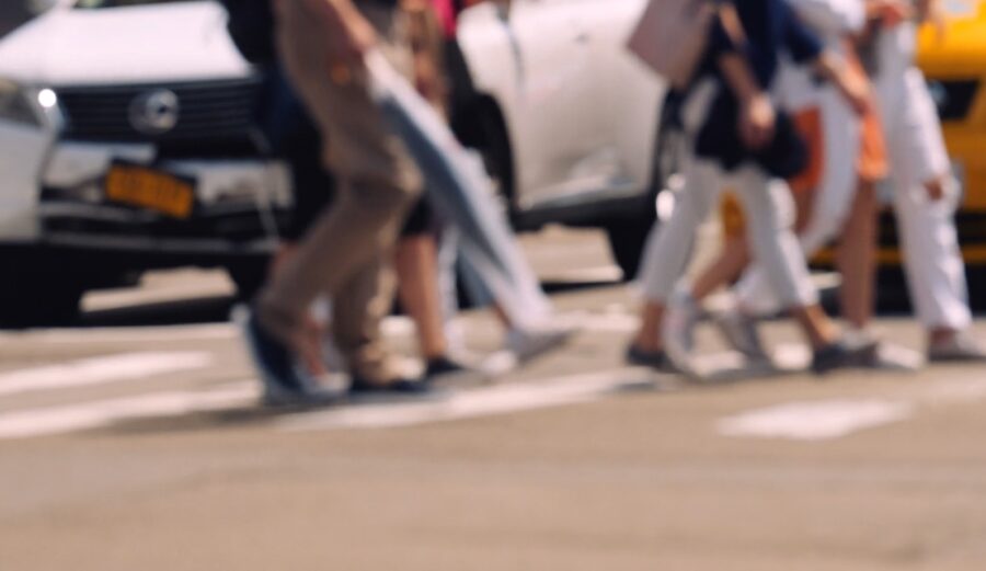 People walking over a crosswalk