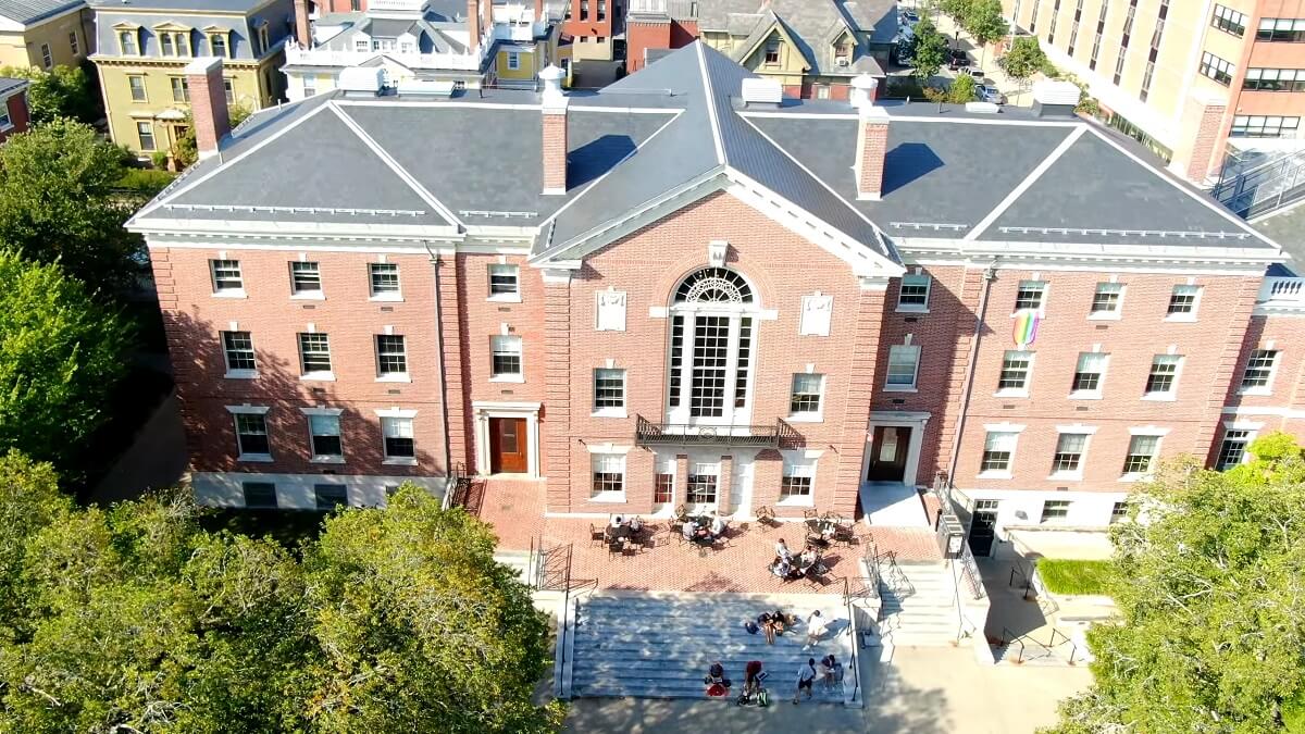 Aerial shot of a prominent building at Brown University, characterized by its red brick facade and classic architectural style