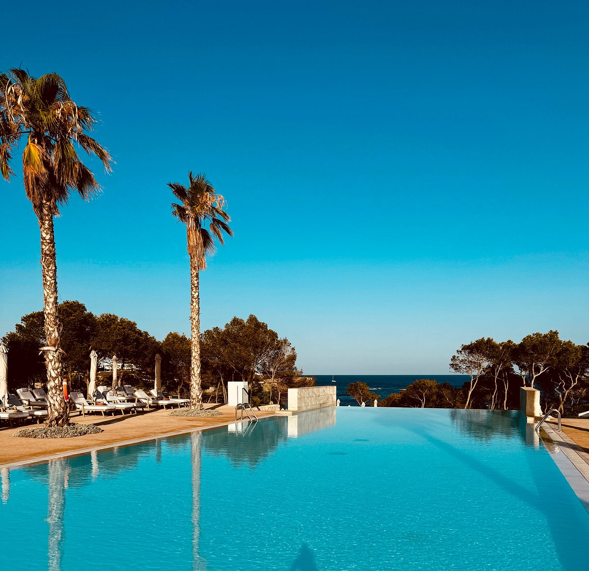 Pool at Ikos Porto Petro Resort in Mallorca with a stunning sea view