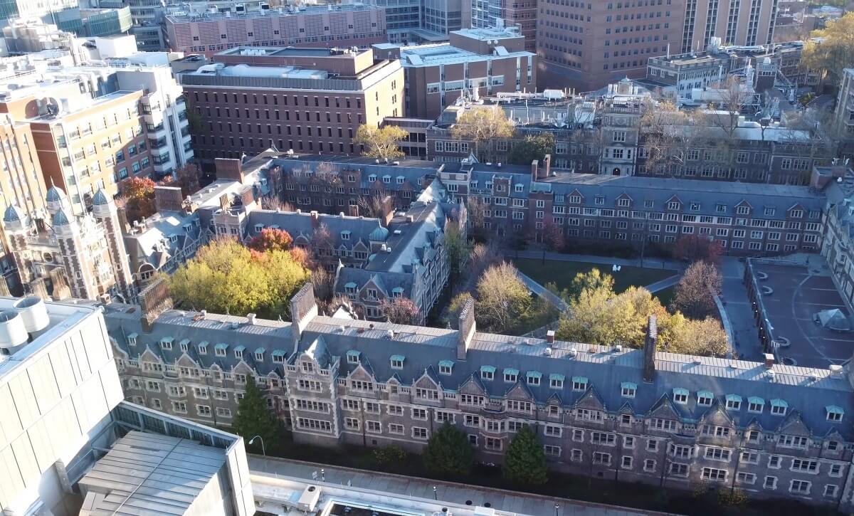 An aerial view of the University of Pennsylvania campus, highlighting the extensive layout of buildings and courtyards