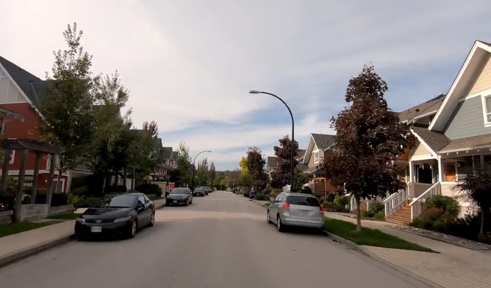 A street with cars parked on the side