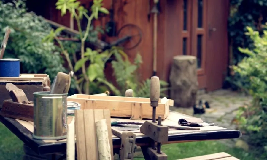 A set of old tools in the backyard on a table