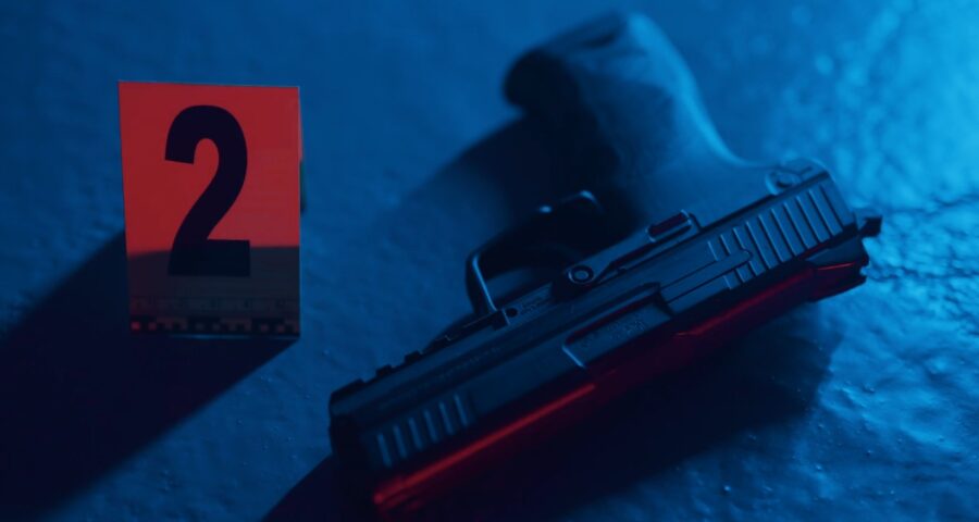 A close up photo of a gun on a crime scene