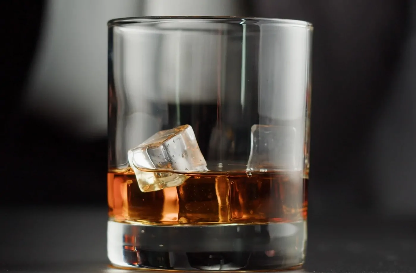 Glass with whiskey and ice