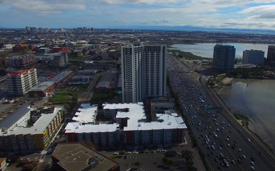 Busy street full of cars in Emeryville, drone shot