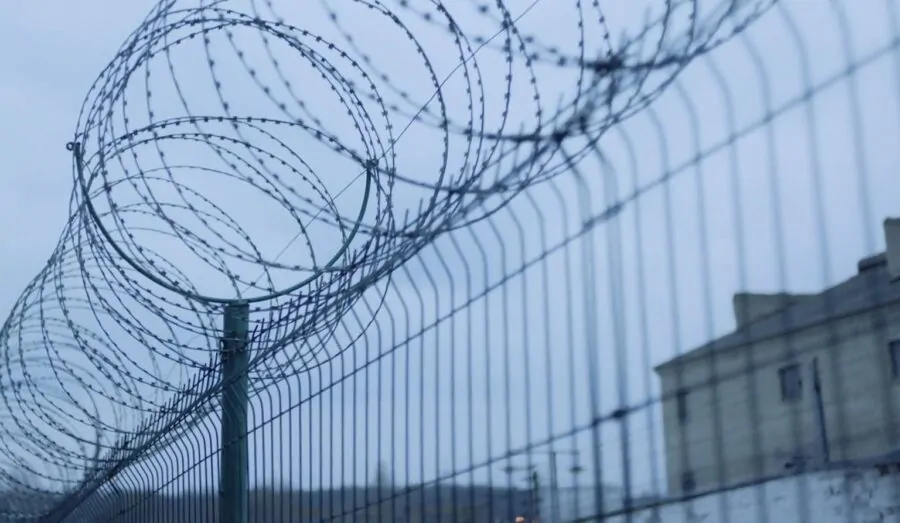 Prison wire fence on a rainy day