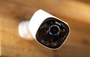 Close up of a security camera mounted to a house