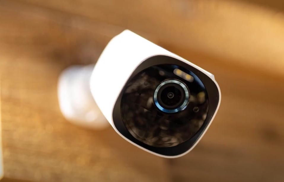 Close up of a security camera mounted to a house