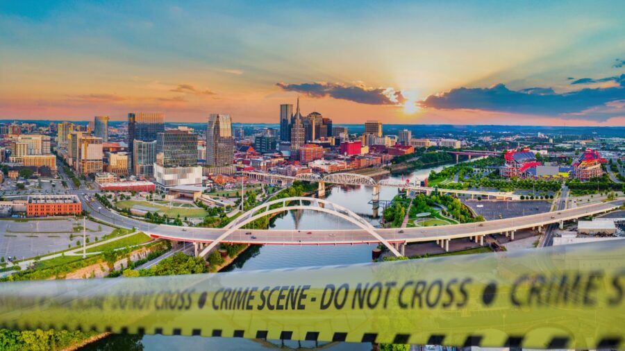 Drone view of Tennessee with crime scene tape running across the photo