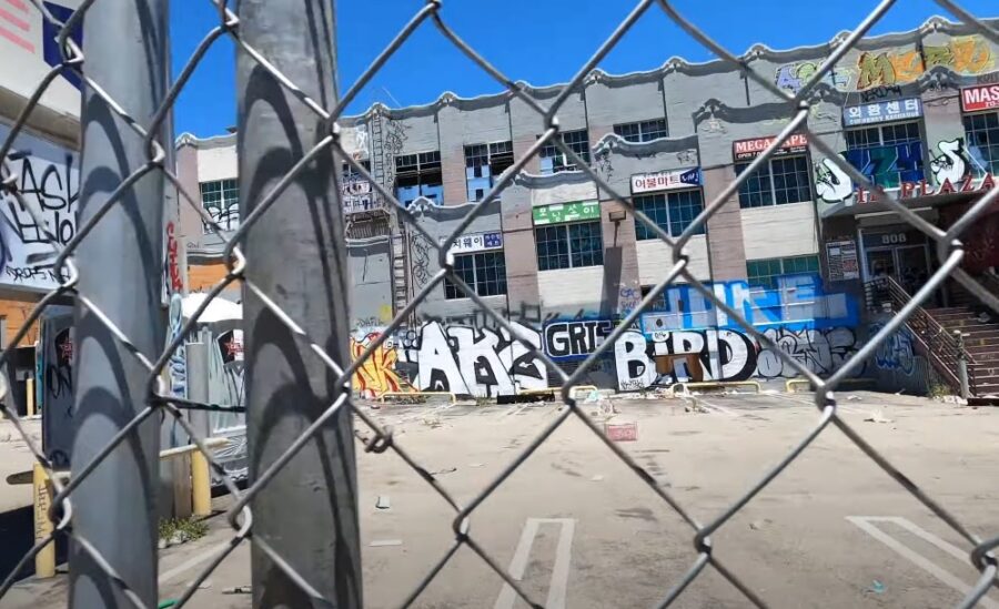 Building in Koreatown captured through the wire fence