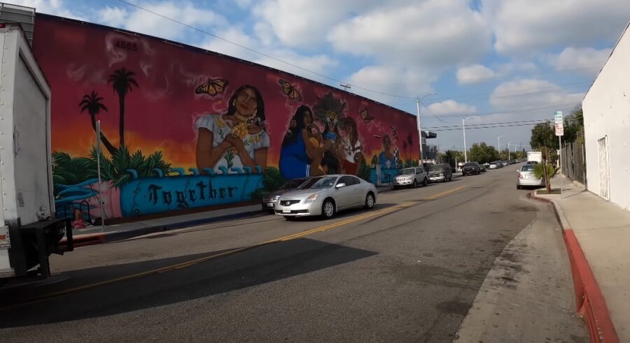 Street in East LA with building covered in graffiti