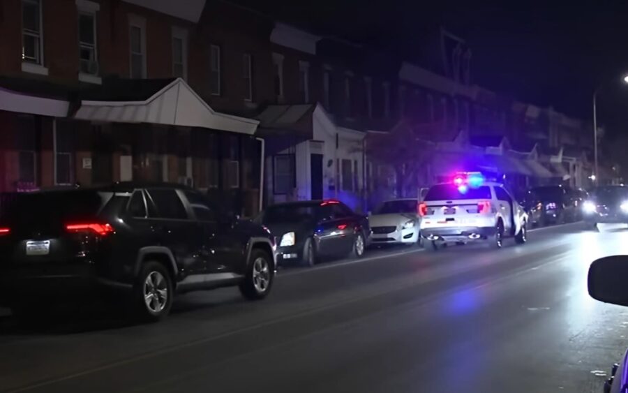 Police at a crime scene in North Philly at night