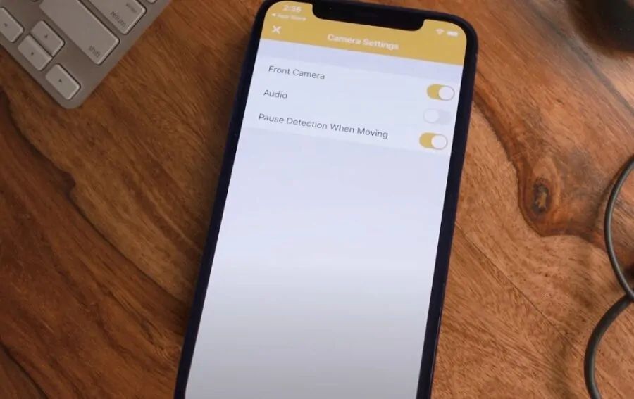 Phone on a desk displaying camera setup menu