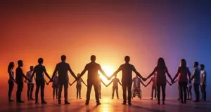 Large group of people holding hands in a circle