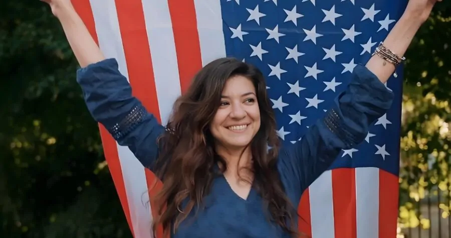 Woman holding American flag in her hands