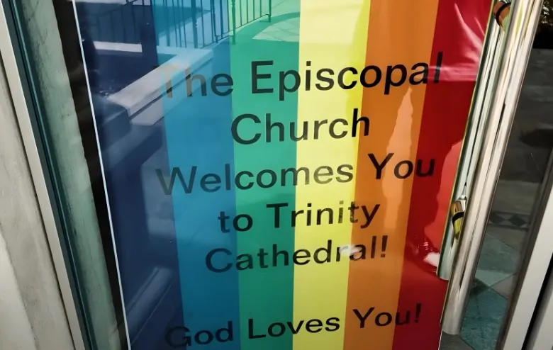 A vibrant rainbow banner welcomes visitors to Trinity Cathedral