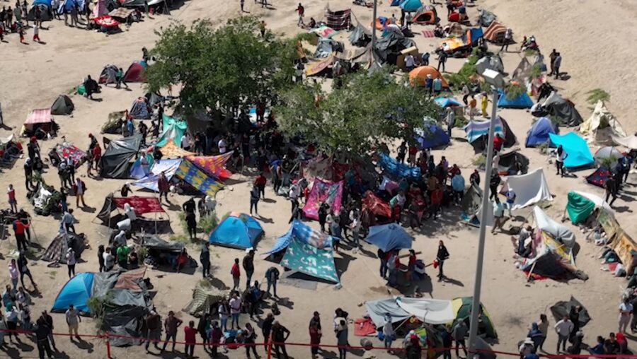 A large encampment of tents and people