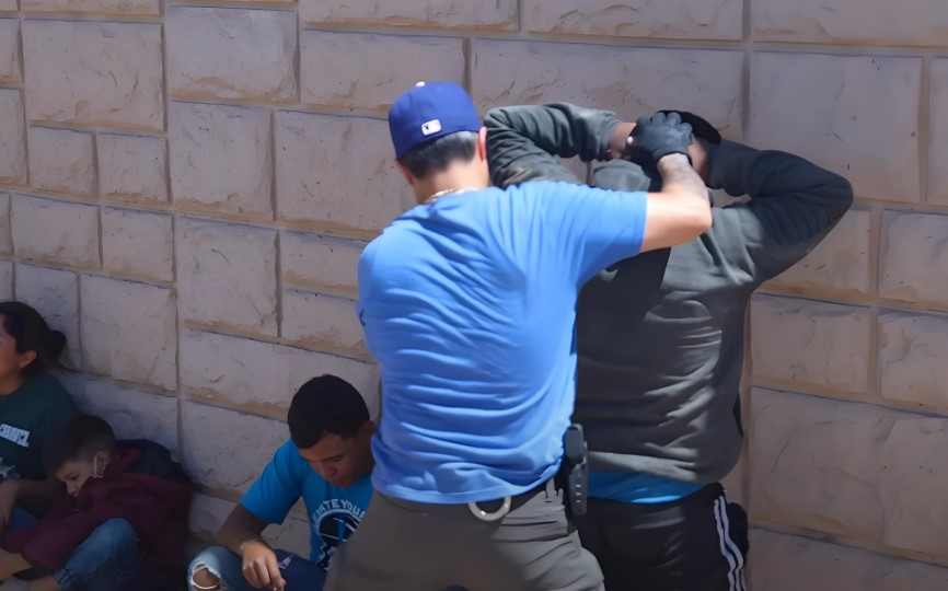 Border police arresting illegal migrant