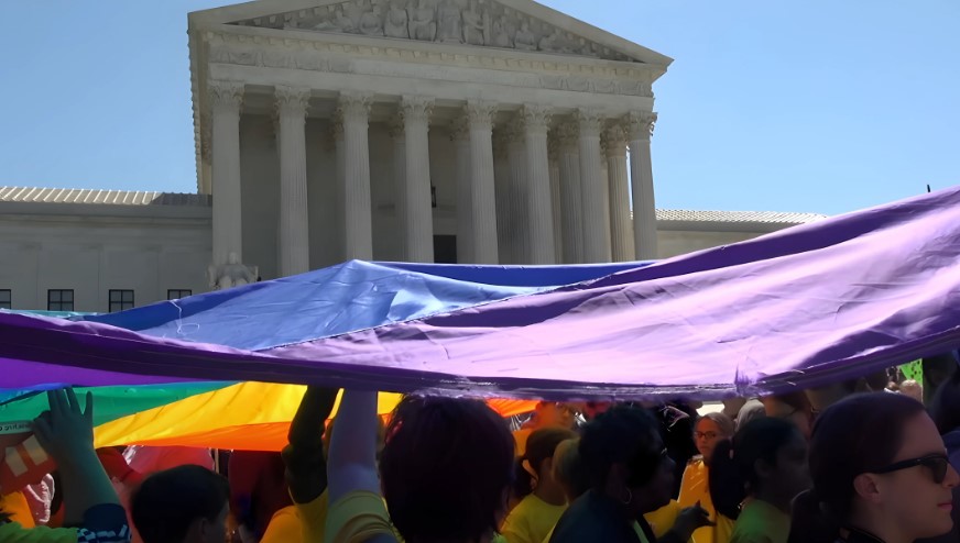 A vibrant LGBTQ+ demonstration unfolds before the Supreme Court building