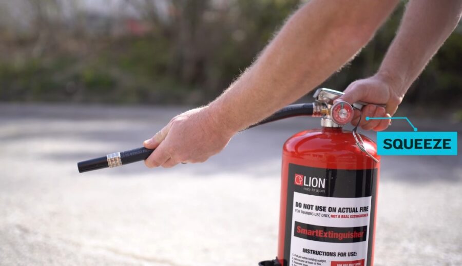 Person using fire extinguisher