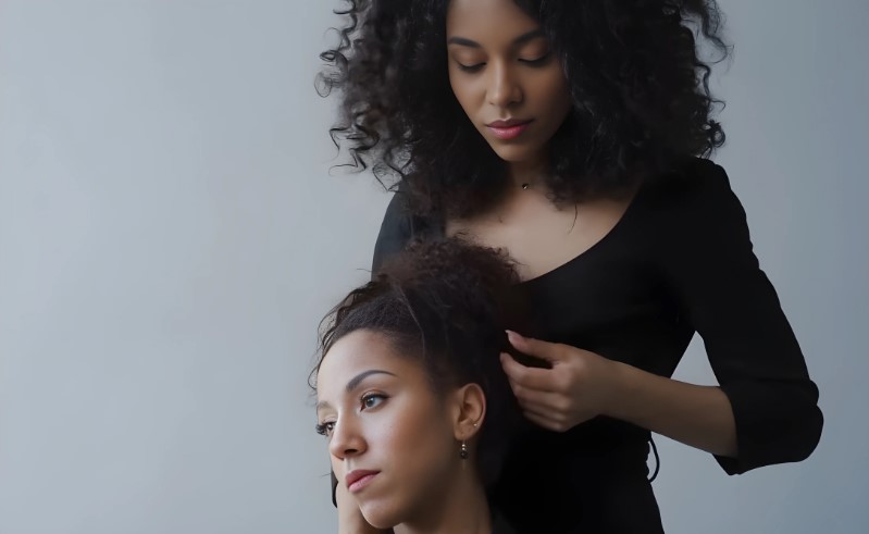 Two Black women are in a close-up