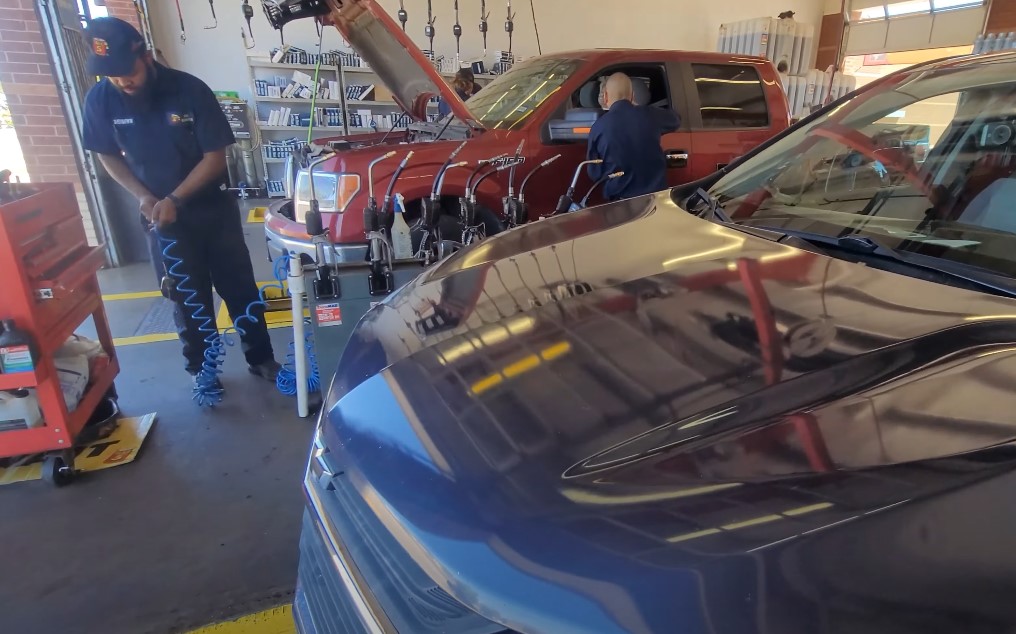 Two vehicles in a car workshop