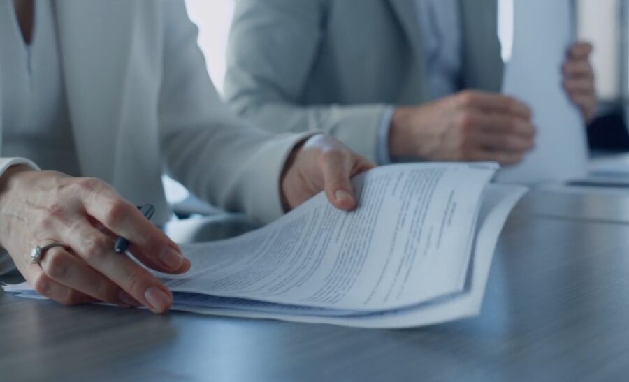 Close-up view of hands reviewing documents