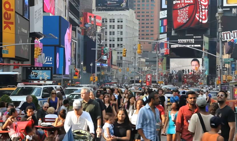 Pedestrians and vehicles navigate the crowded streets of Times Square