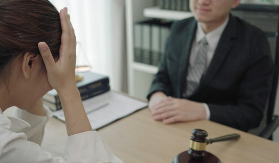 A client's distress is palpable during a meeting with her lawyer