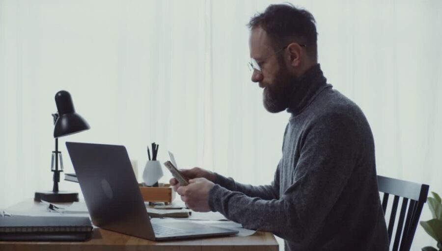  quiet moment of calculation, as the man reviews his earnings