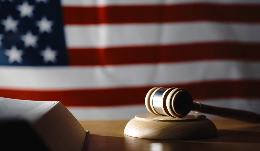 A gavel rests on a stand, symbolizing justice in the American legal system