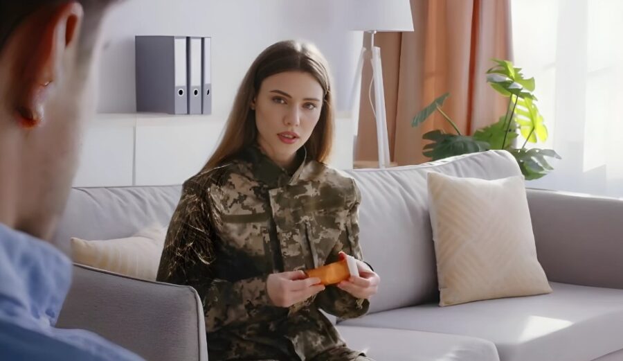 A military woman holds medication during a counseling session