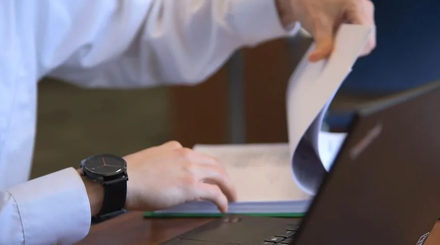 Close-up of hands reviewing documents