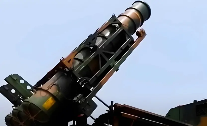 A sophisticated missile launcher, poised for deployment against a clear sky