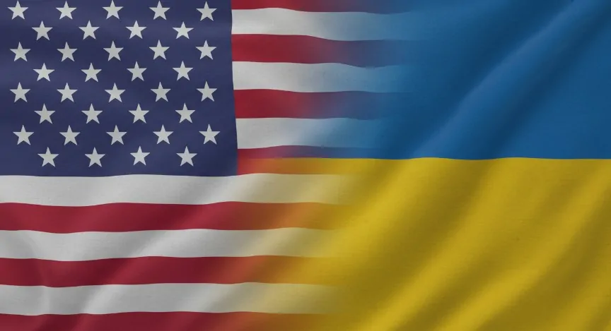 A digitally blended image showing the United States flag on the left and the Ukraine flag on the right, both waving in the wind. The transition between the two flags is smooth and slightly blurred in the center, symbolizing unity and partnership. The fabric texture is visible, and the lighting highlights the folds and motion of the flags