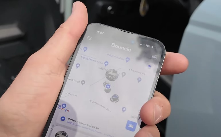 A smartphone displays a location-based service, highlighting nearby parking spots