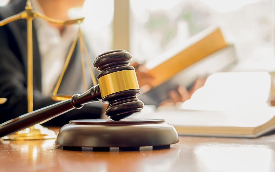 A gavel on a desk shows how injury settlements have shaped the law