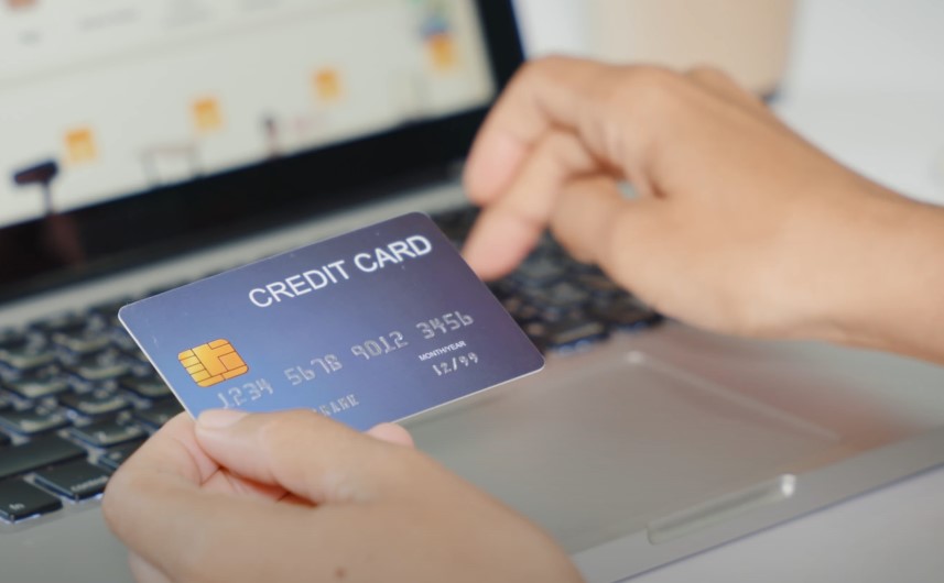 Hands holding a credit card, ready for online payment