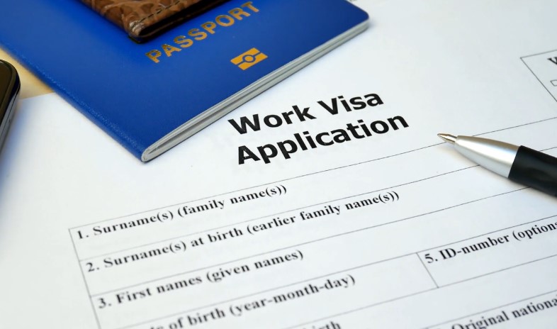 A completed work visa application form, ready for submission