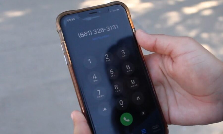 Woman calling police on her phone