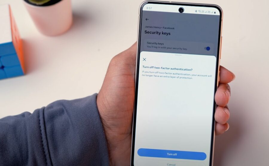 Hand holding a phone, showing how to secure your account