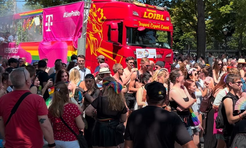 A vibrant Pride parade, filled with diverse individuals celebrating their identities