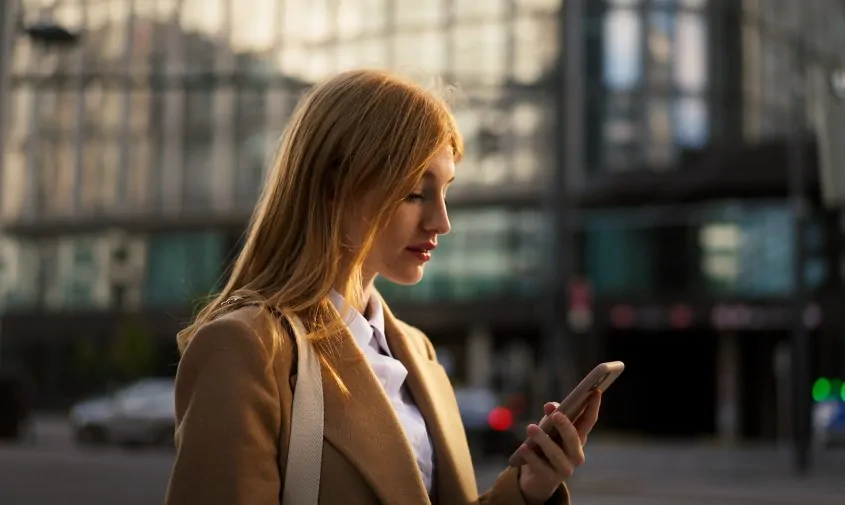Woman checks her phone