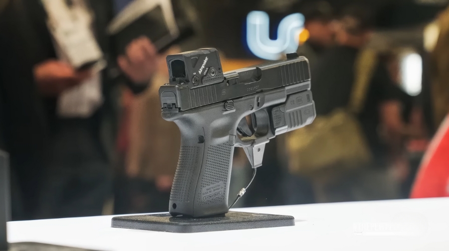 A handgun displayed at an event highlights the question of how many guns exist in America