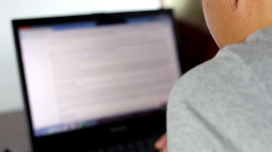 Person using a laptop to search how to unblock a website