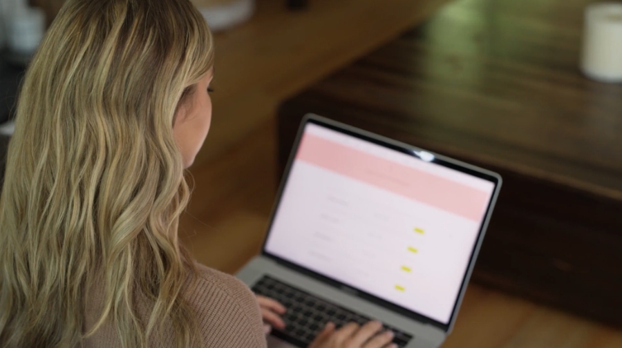 Woman using a laptop to check if a website block is real before trying to unblock it