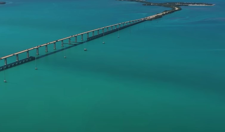 Aerial view of the Key West Bridge, showcasing its structure and surrounding turquoise waters