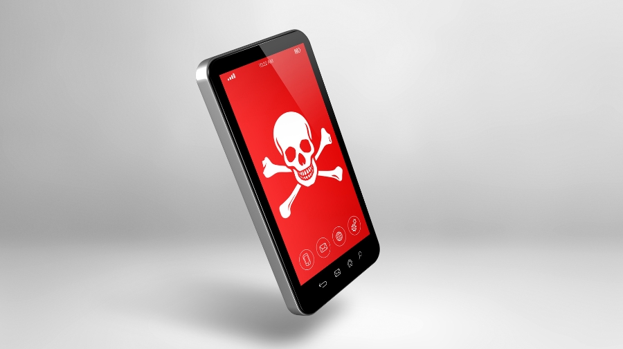 A smartphone screen shows a red warning with a skull and crossbones